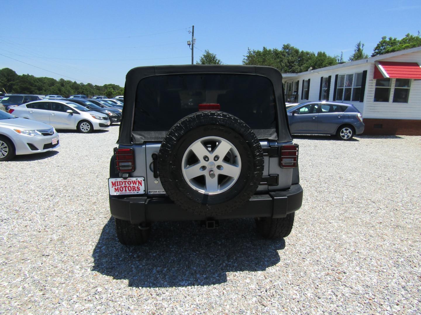 2013 Silver Jeep Wrangler Unlimited Sport 4WD (1C4BJWDG2DL) with an 3.6L V6 DOHC 24V FFV engine, Automatic transmission, located at 15016 S Hwy 231, Midland City, AL, 36350, (334) 983-3001, 31.306210, -85.495277 - Photo#6